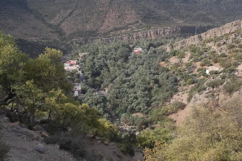 A small village tucked into a wooded valley in the hills on the road to Imouzzer